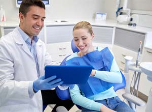 Implant dentist in Goodyear explaining treatment to a patient
