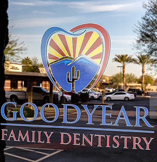 Goodyear Family Dentistry logo on dental office entry door