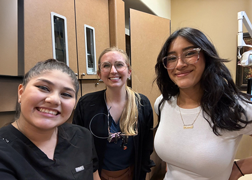 Close up of dental team members smiling