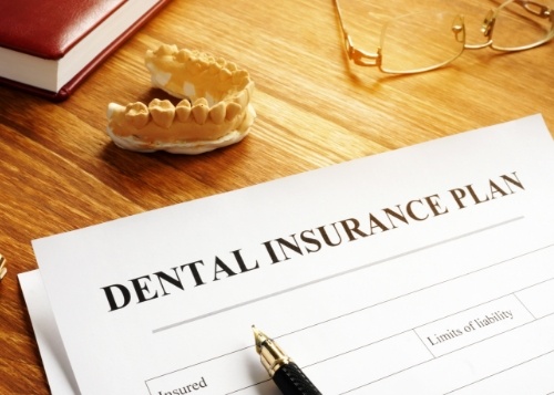 Patient filling out dental insurance forms