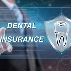 Emergency dentist in Goodyear pointing to dental insurance graphic