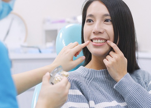 A woman at a smile makeover consultation