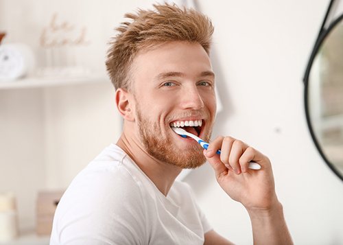 A man brushing his teeth
