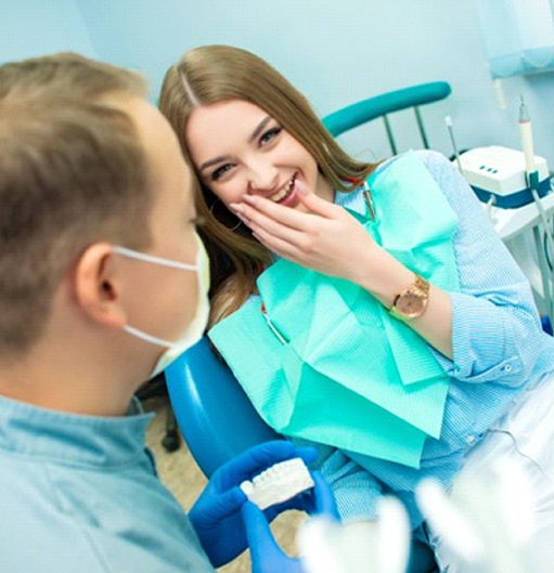 young woman at a consultation with her cosmetic dentist in Goodyear, AZ