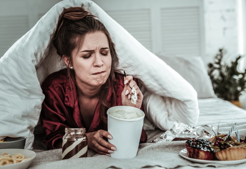 person eating ice cream and other sweets