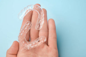 Clear aligners in palm of hand