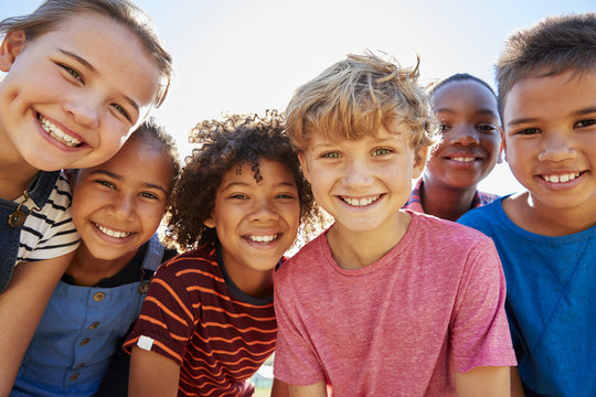 group of kids who underwent cosmetic dentistry smiling