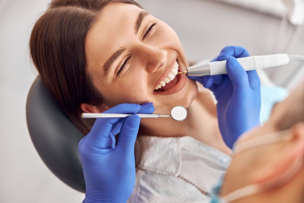 A smiling woman at the dentist
